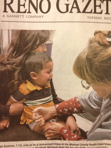Reno Gazette Journal -- Nurse Jabs Baby with Flu Vaccine