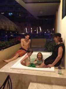Family in outdoor bathtub on patio in Puerto Vallarta, Mexico