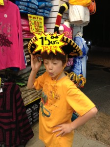Boy models funny sombrero with price tag still on it