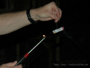 lighting a Flower firecracker