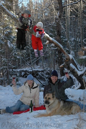 Picnic in the snow with the kids hanging in the trees -- our holiday card